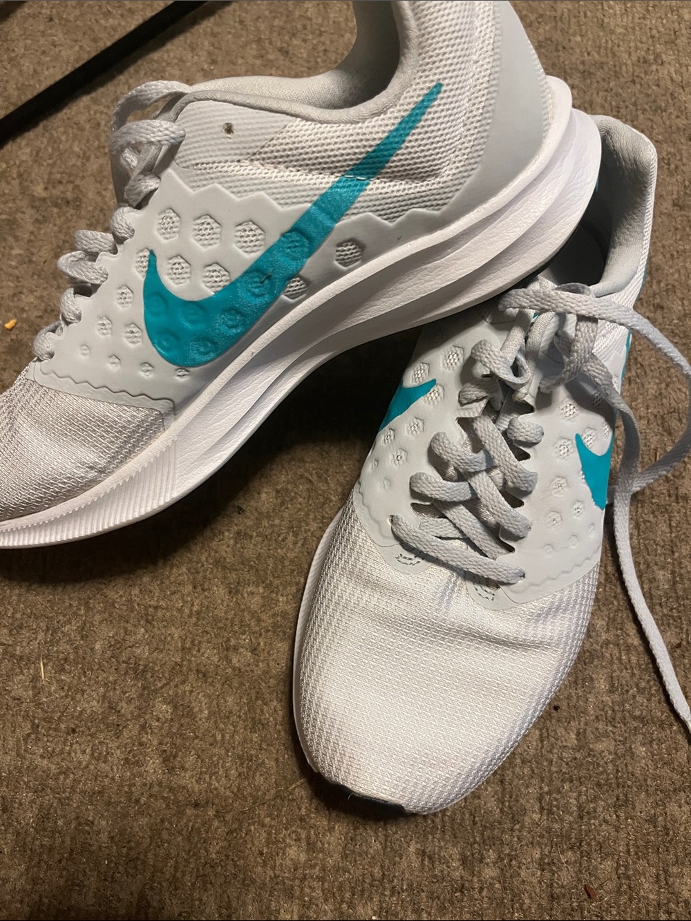 Nike Women's White Athletic Sneakers with Teal Swoosh Accent